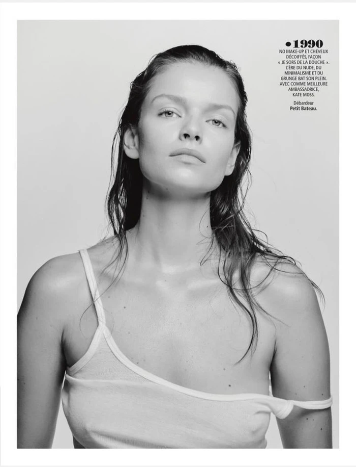 Black and white portrait of model Marie-Louise Wedel in a white tank top with wet hair against a pale studio background.