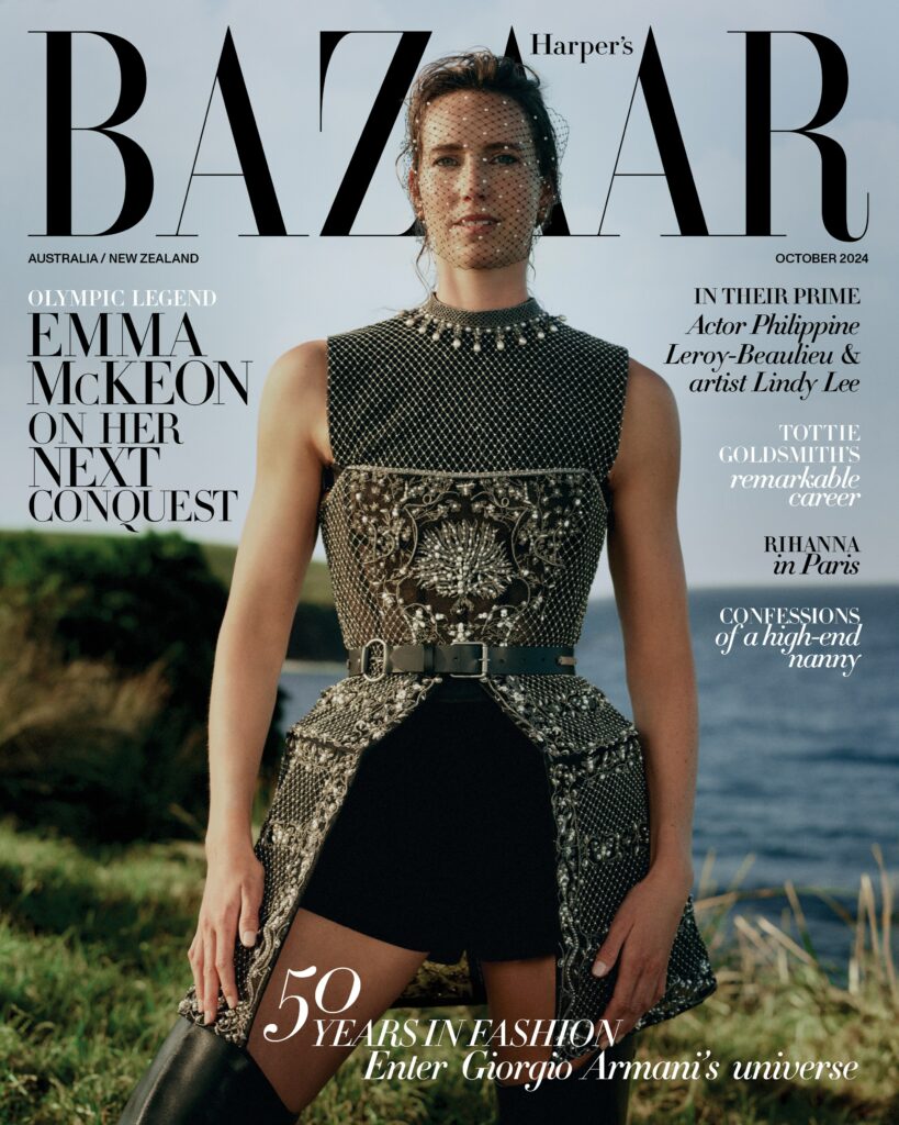 Emma McKeon, Olympic legend, graces Harper's Bazaar cover in embellished sleeveless dress and thigh-high boots against coastal backdrop.