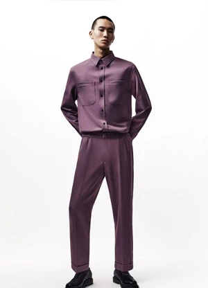 Model Yuto Ebihara wearing a purple button-up utility shirt and matching trousers against a plain white studio background.