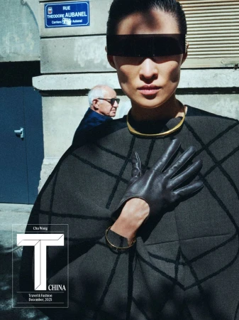 Fashion editorial shot outdoors featuring an Asian model in a modern cape with sunglasses and gloves, complemented by an elderly man in the background.
