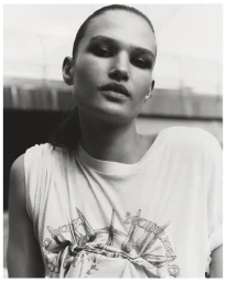 Portrait of Emmi Freeman wearing a printed t-shirt captured in a black and white editorial style.