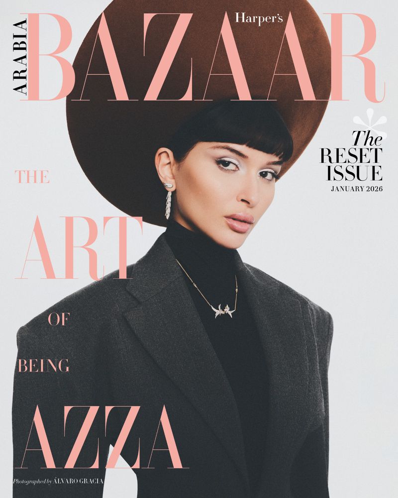 Magazine cover featuring a woman wearing a large hat and a blazer. The cover text is: 'BAZAAR, The Art of Being Azza'.