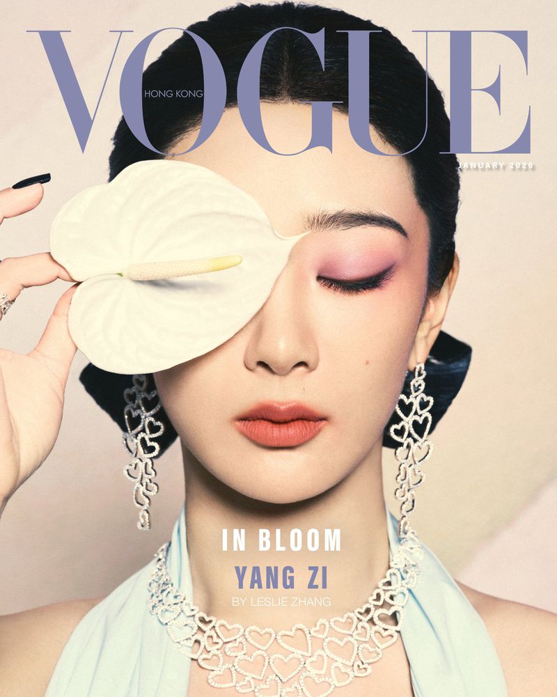 Vogue Hong Kong cover featuring Yang Zi with elegant makeup, heart-shaped jewelry, and anthurium flower covering one eye, January 2023.
