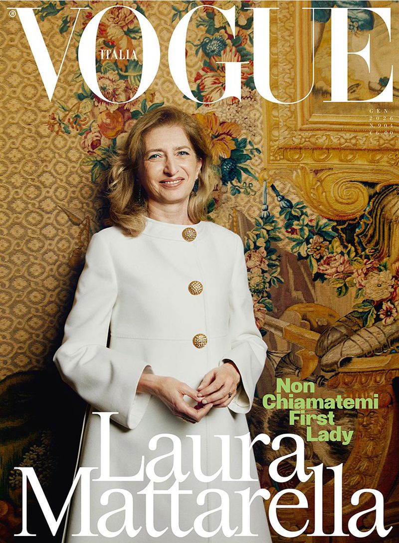 Vogue Italia cover featuring Laura Mattarella in a white jacket, in front of floral patterned wallpaper and a large ornate painting.