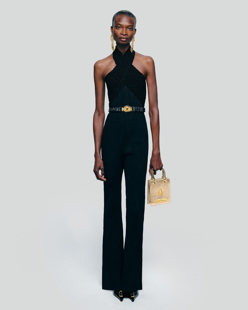 Elegant Black Woman in Halter Top and Pants with Accessories Posing in Studio for Fashion Editorial Photography, Full Length