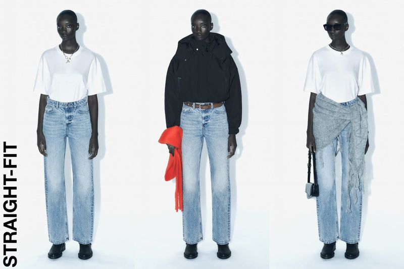 Three dark-skinned women model straight-fit light blue jeans with white t-shirts in a fashion studio setting against a bright white backdrop.