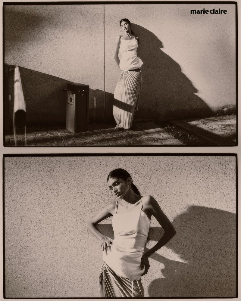 Monochrome fashion shot of a slender woman in a light dress posing against a wall, split into two separate frames with a retro aesthetic.