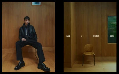 Model wearing dark leather jacket and trousers seated on chair in wood-paneled room for Massimo Dutti