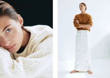Model wearing a brown knit sweater and white maxi skirt standing against a white studio background.