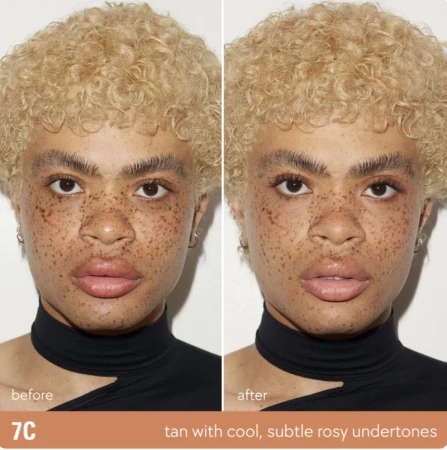 Close-up split screen of a person's face before and after makeup. The person has freckles and curly blonde hair, and is wearing a black top.