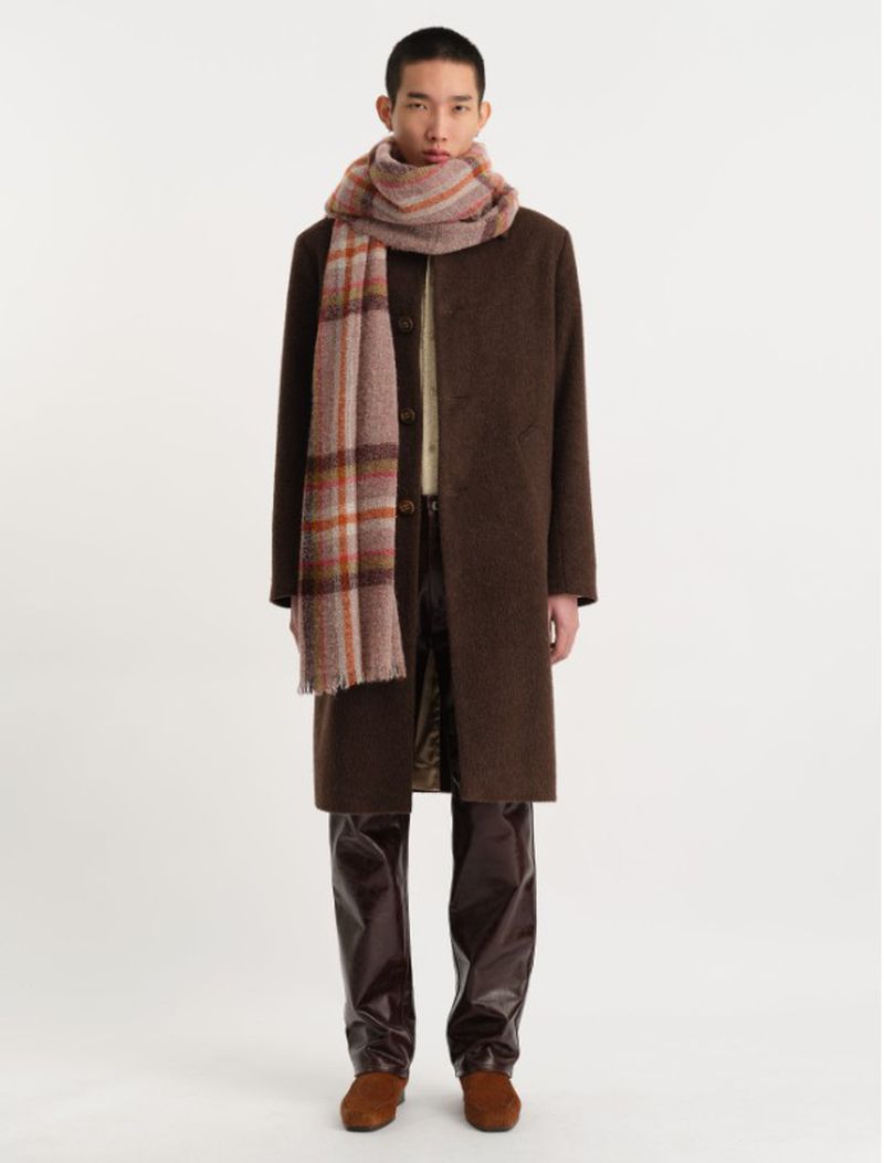 Full-length shot of a young Asian man wearing a brown overcoat and plaid scarf, posing against a neutral background, fashion photography.