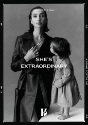 Monochrome portrait of a woman wearing a dark coat and layered necklaces next to a child for Kennedy