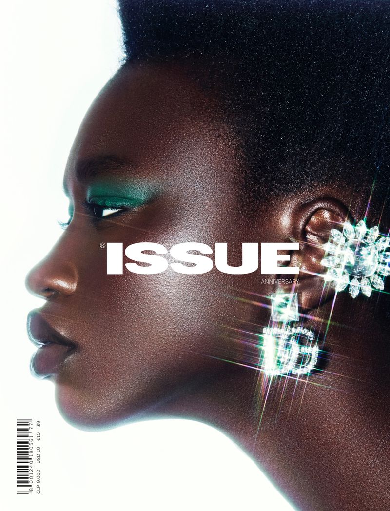 Magazine cover featuring a dark-skinned Black woman with green eye makeup and large jewel earrings, with the white 'ISSUE' logo.