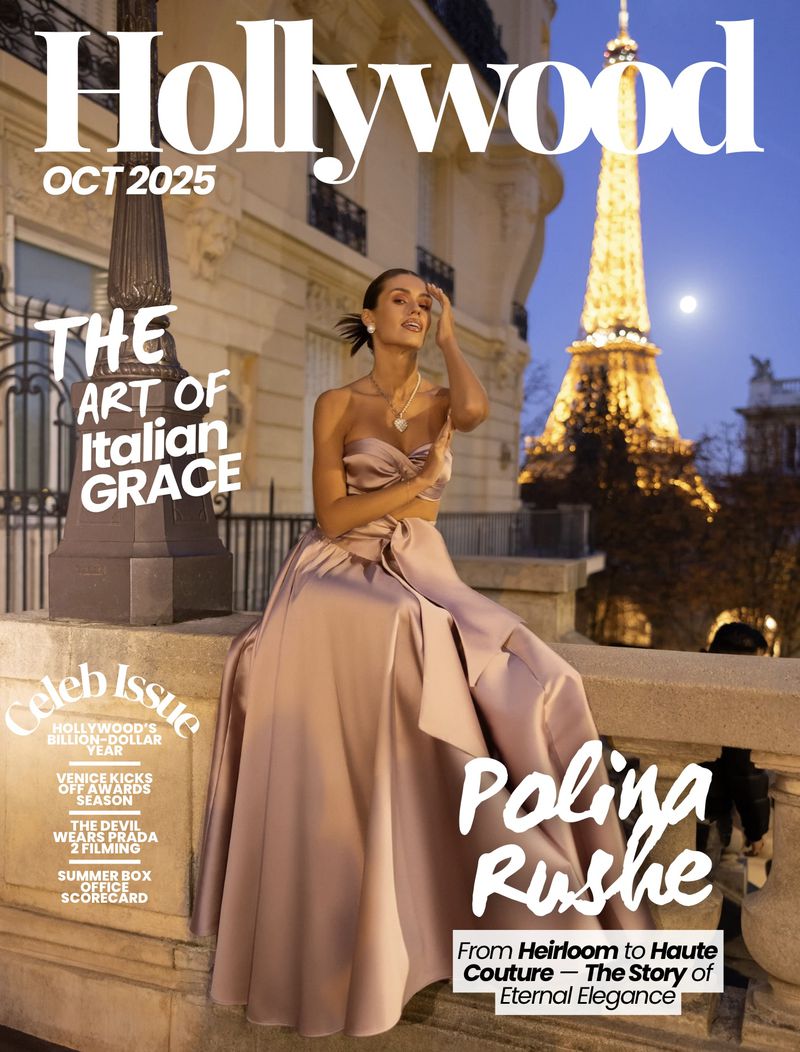 Magazine cover featuring a model in a gown, seated with the Eiffel Tower in the background, against a twilight sky in Paris, France.