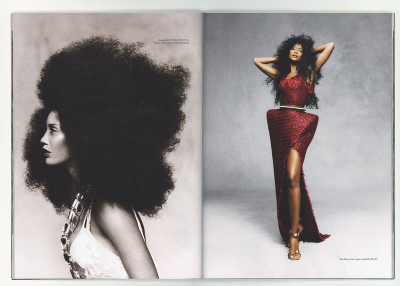 Magazine spread features two Black women in haute couture; one profile view with a large Afro, the other full length in a red gown.