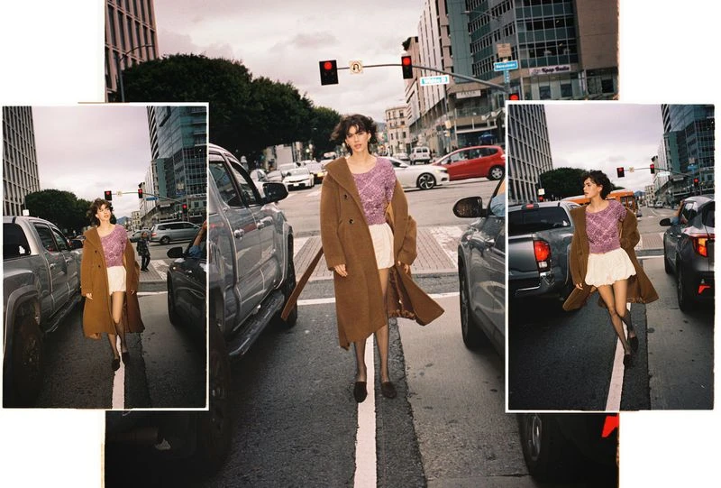 A woman in a brown coat walks across a city street between cars, captured in a triple-exposure collage-style image.