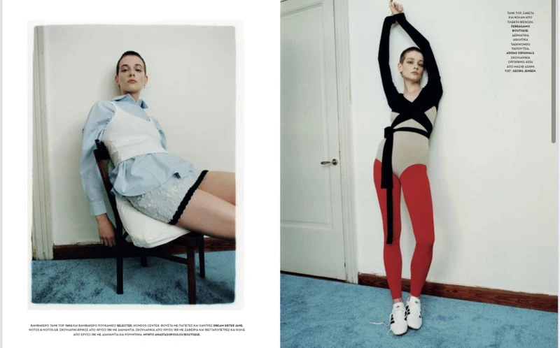 Editorial fashion shot: Two adult women pose indoors against a white wall in modern clothing, one seated, the other standing.