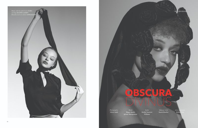 Monochromatic fashion editorial featuring two adult females in studio. One model wears a dark veil; the other lifts a scarf over her head.