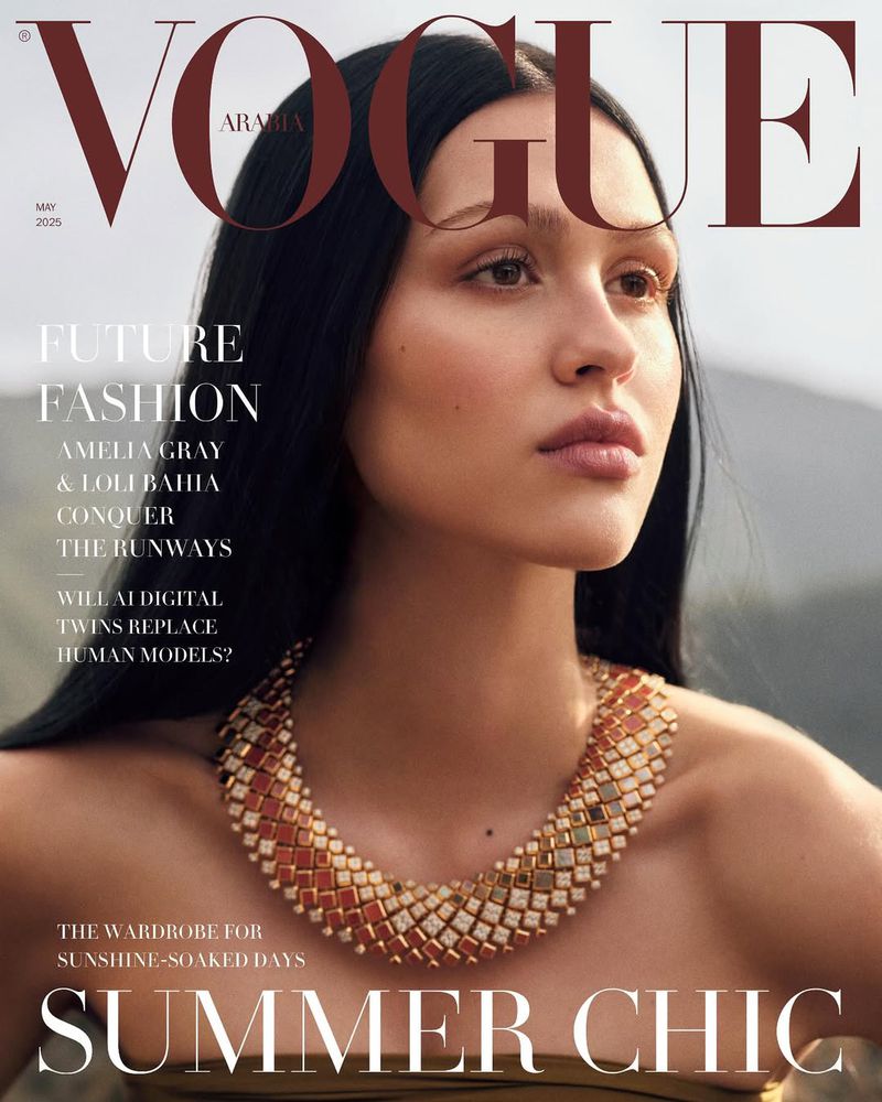 Vogue Arabia cover featuring a young woman with dark hair and a gold and orange necklace, outdoors with blurred background.
