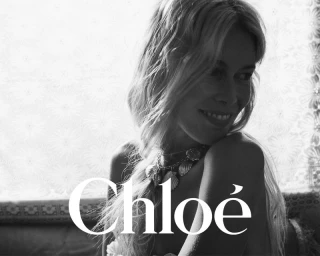 Claudia Schiffer in a black and white portrait wearing a shell necklace for Chloe High Summer 2025 campaign