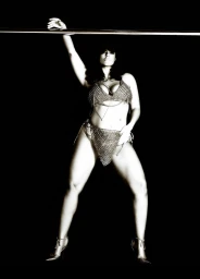 Model Ashley Graham wearing a chainmail lingerie set against a solid black background for V Magazine
