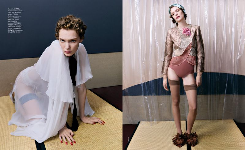 Fashion editorial shot features a posed model in semi-sheer white robe and another in a pink bathing suit and gold jacket in studio.