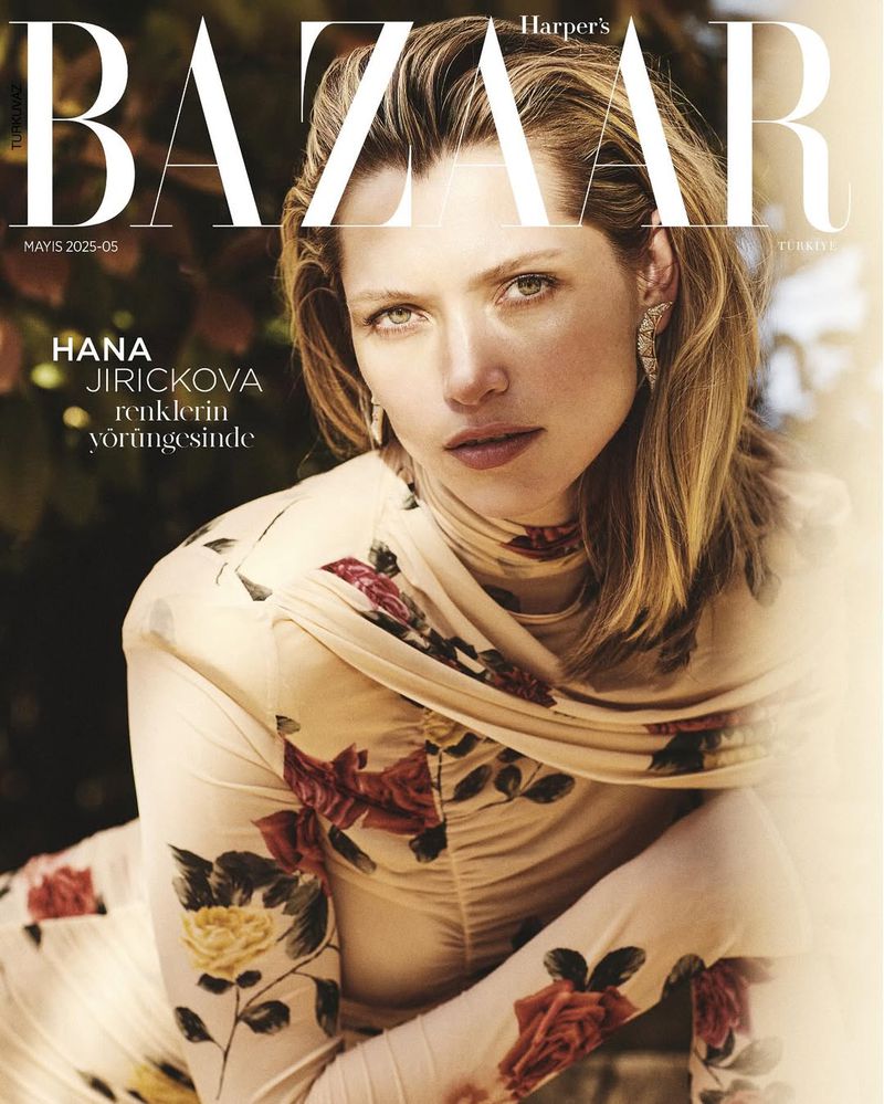 Fashion magazine cover featuring a blonde woman in a floral dress, posing for a portrait-style shot with 'BAZAAR' in bold text.