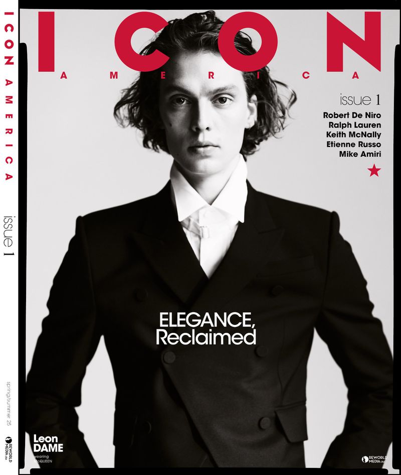 Magazine cover featuring model in a black suit, against a light gray background. 'ICON AMERICA, Issue 1' is displayed on the cover.