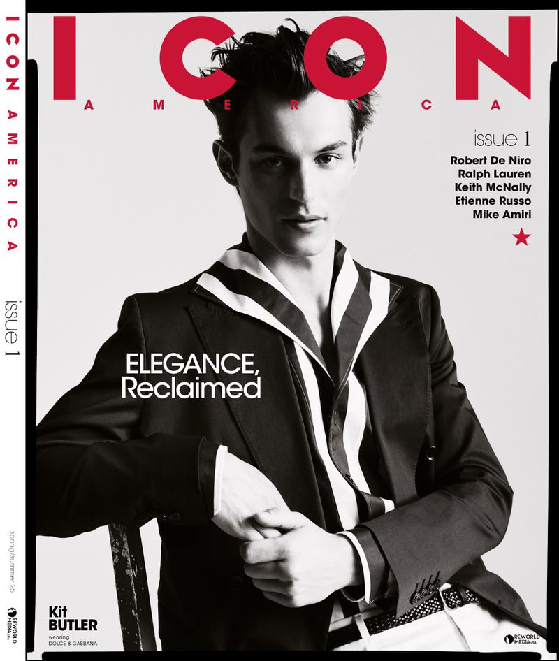 Black and white fashion magazine cover featuring a young adult male model in a striped shirt and black suit jacket looking at the camera.