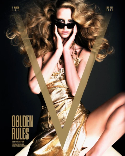 Blonde woman in golden dress and sunglasses poses on a magazine cover with a V logo and "Golden Rules" headline against a dark background.