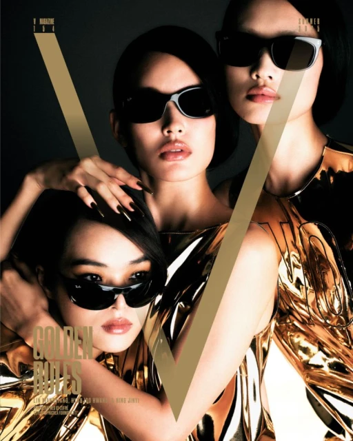 Magazine cover featuring three Asian women wearing sunglasses and shiny gold outfits, a large gold 'V' in the foreground.