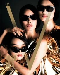 Three models wearing black sunglasses and metallic gold tops against a dark background for V Magazine cover