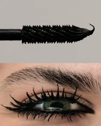 Macro view of black mascara wand and an eye with heavily coated eyelashes and styled eyebrow