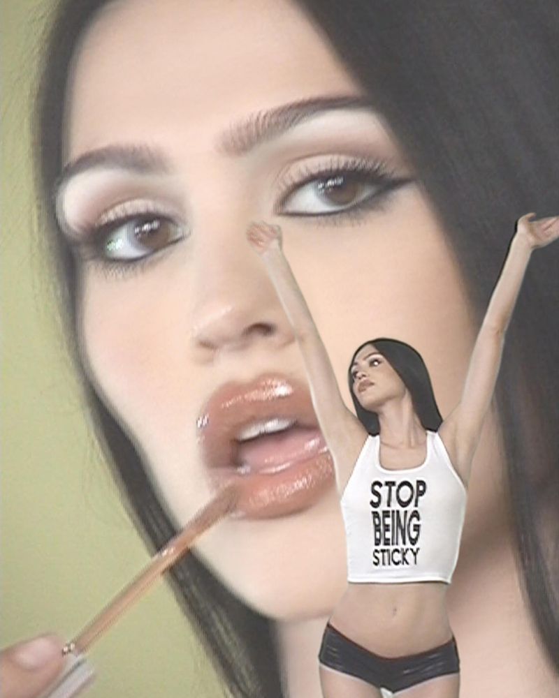 Glamorous beauty shot of a woman with dark hair applying lip gloss, with another woman in a crop top striking a pose in the foreground.