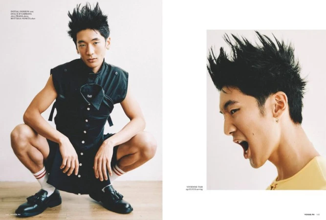 Editorial fashion shot of a young Asian male model crouching in a sleeveless black top and shorts, with close up of his expressive face.