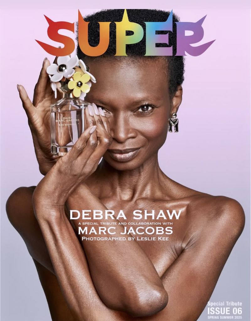 Black woman poses with perfume bottle on fashion magazine cover; 'Super' text logo in rainbow colors; Debra Shaw, Marc Jacobs collaboration.