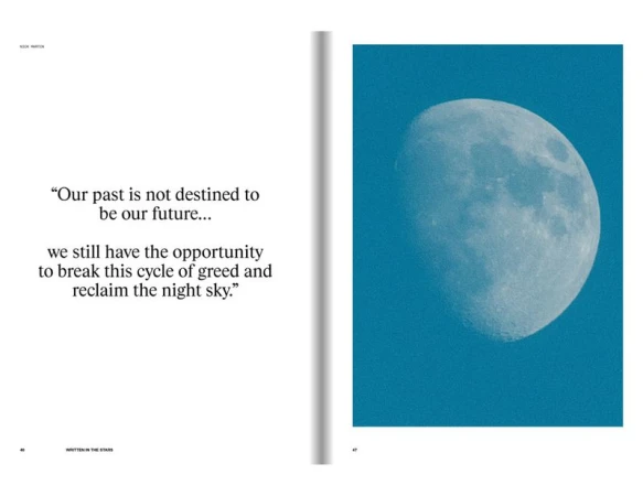 Close-up view of a half moon against a gradient blue sky, presented next to a page of inspirational text in a book.