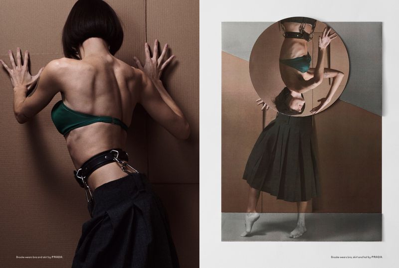 A woman in a green bra and black skirt is featured in a fashion photo; an upside-down mirror reflects the same outfit on a posterized surface.