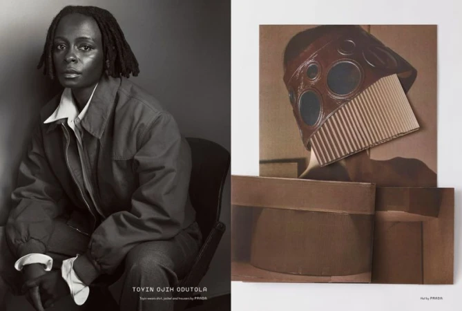 Monochromatic studio shot showcases an adult with dreadlocks in collared shirt and jacket, seated by a cardboard art piece.