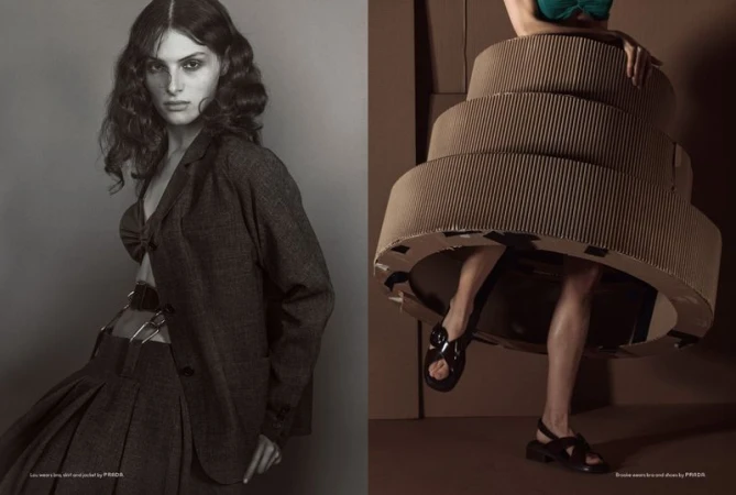 Monochrome fashion editorial featuring a woman in a blazer, skirt, and bra contrasted with a woman in a cardboard sculpture dress.