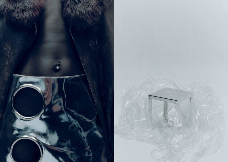 Fashion editorial shot featuring a torso with a piercing, a skirt with large metal circles, and a fur-collared coat against a stark white backdrop.