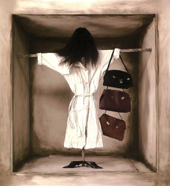 Conceptual studio shot features a mannequin in a white coat with a black wig, displayed in a box-like room with three handbags.