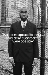 Portrait of a Black man wearing a black double-breasted suit standing in front of a chain-link fence with overlaid text.