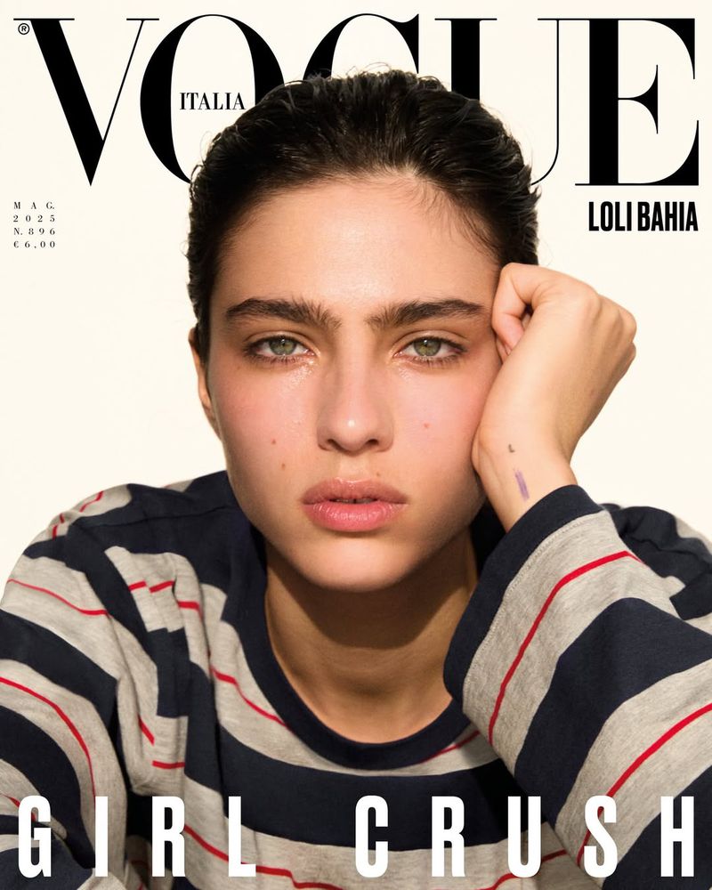 Close-up magazine cover featuring Loli Bahia wearing a striped top against a plain background with bold Vogue Italia masthead text.