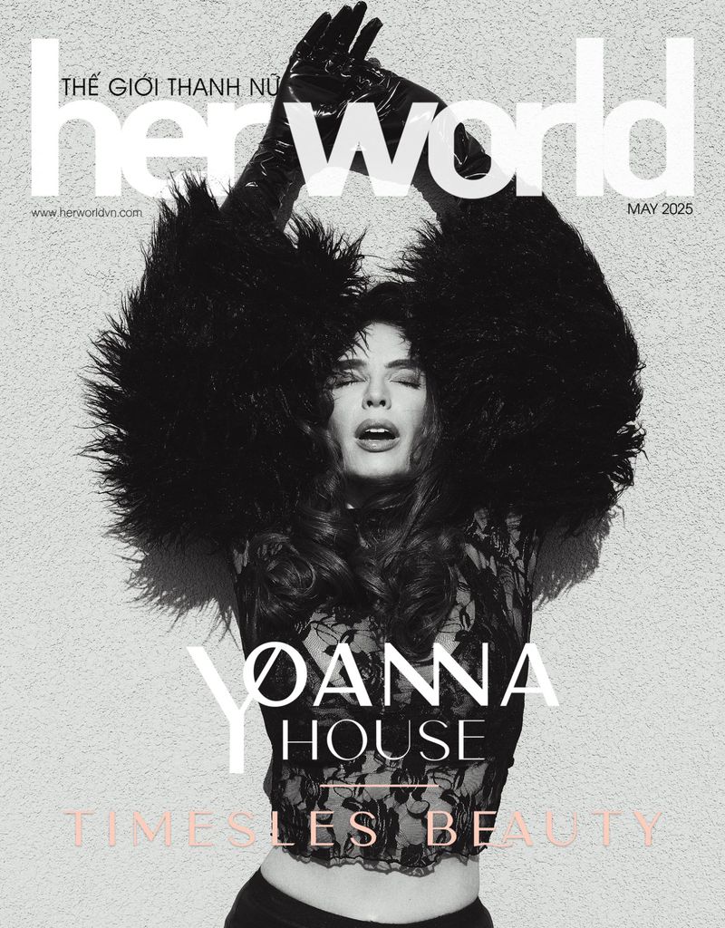 Her World magazine cover featuring a woman with dark hair, wearing black gloves and lace top, with feathered accents. May 2025 issue.