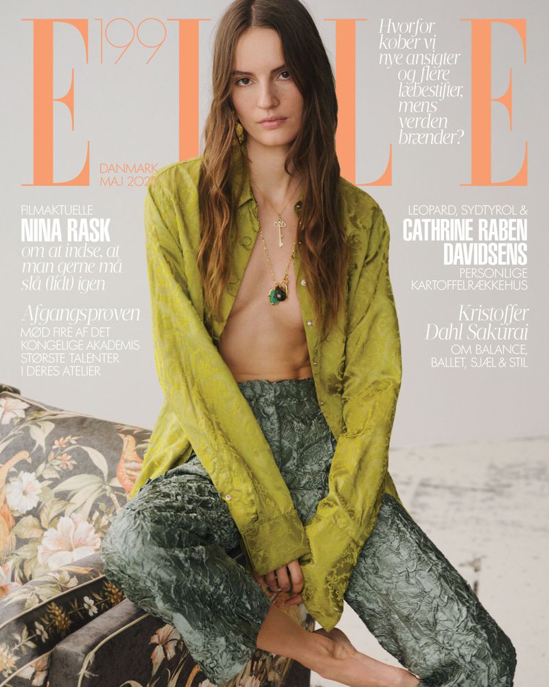 Elle Danmark cover featuring a young woman with long brown hair, wearing a green shirt, and sitting on a floral patterned sofa.
