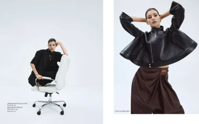 Fashion editorial featuring Valery Kaufman in a black leather jacket and brown trousers against a white seamless background.