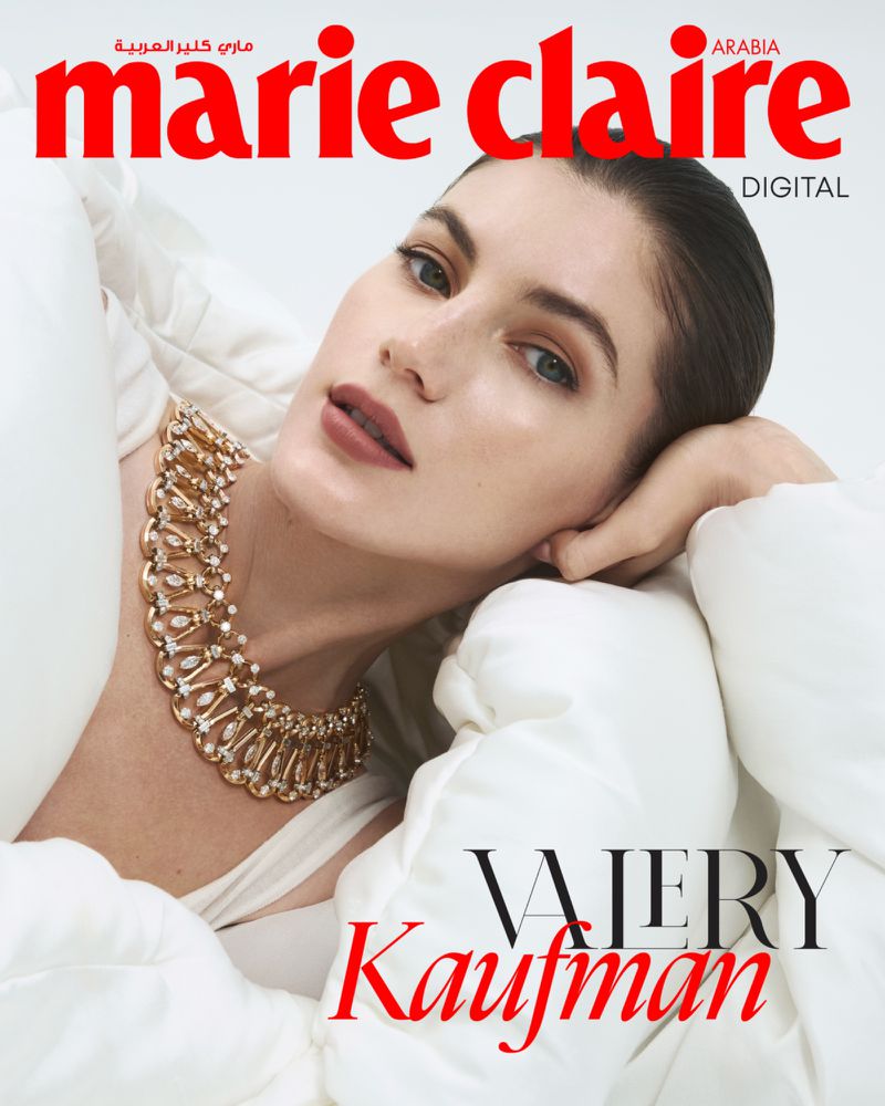 Magazine cover featuring Valery Kaufman wearing a gold necklace and a white puffy jacket, set against a light background, Marie Claire Arabia.