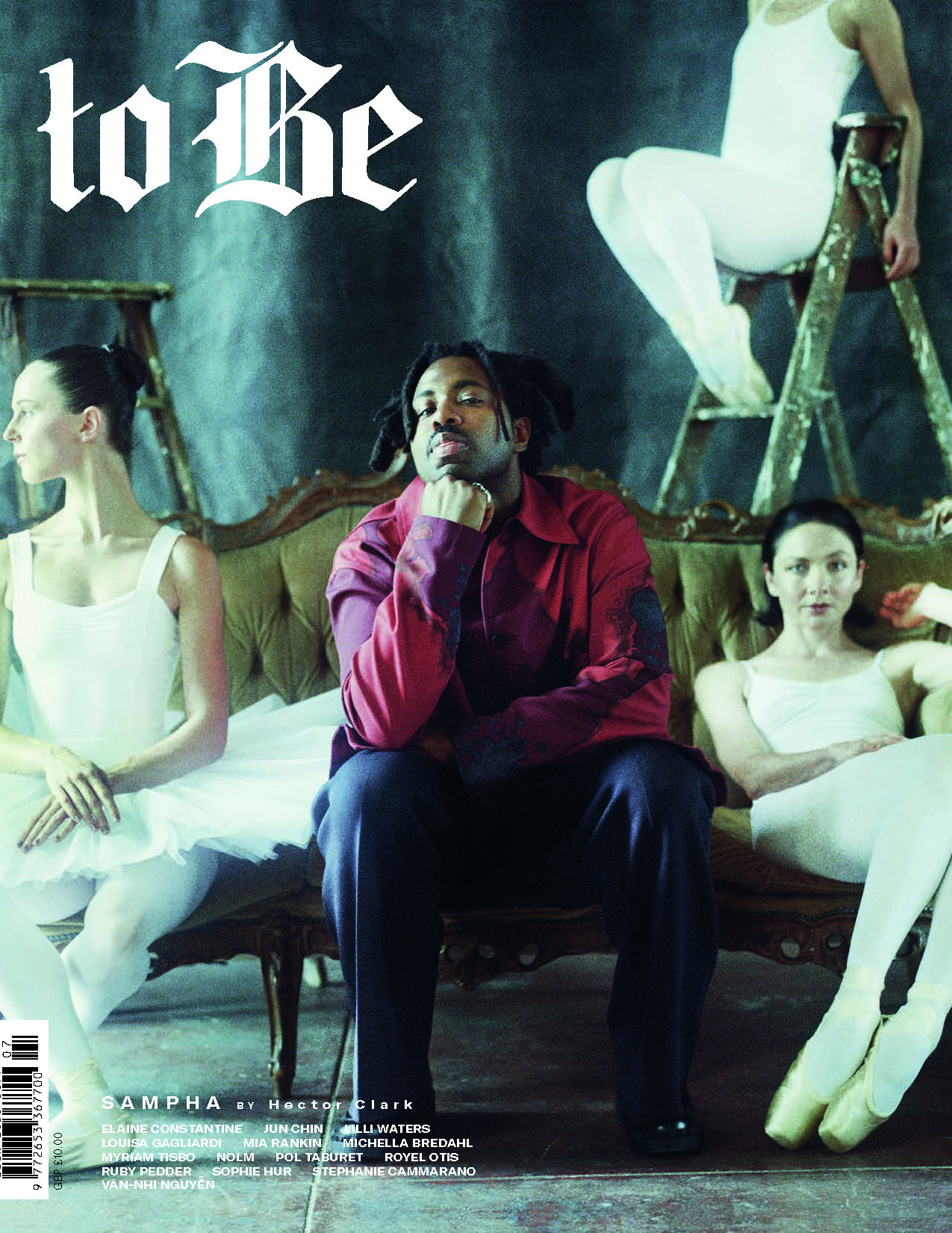 Magazine cover featuring a black man in a red shirt seated on a couch with three ballet dancers in white leotards, and the title 'to Be'.