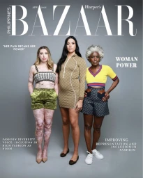 Magazine cover featuring three diverse female models standing against a grey seamless studio background.